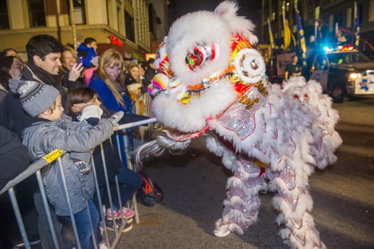 SAN FRANCISCO - FEB 15 : An unidentified participant in a Lion dance at the Chinese New Year Parade in San Francisco , California on February 15 2014 , It is the largest Asian event in North America 