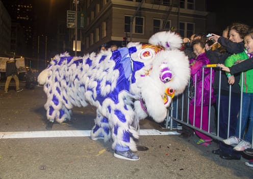 SAN FRANCISCO - FEB 15 : An unidentified participants in a Lion dance at the Chinese New Year Parade in San Francisco , California on February 15 2014 , It is the largest Asian event in North America 