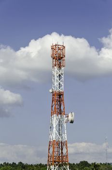 Countryside communication tower against cloudy sky