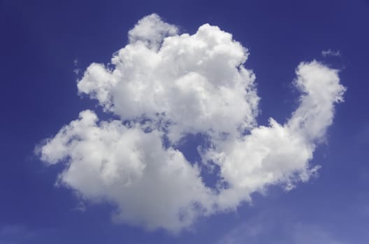 Fluffy cumulus clouds against blue sky