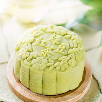 Traditional Chinese mid autumn festival food. Snowy skin mooncakes. The Chinese words on the mooncakes means green tea with red bean paste, not a logo or trademark.