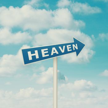 Road sign pointing to heaven, blue sky with clouds as background in vintage retro style.