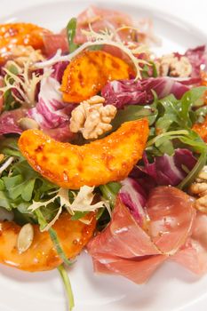 Salad with fried potato, cabbage, ham and nuts