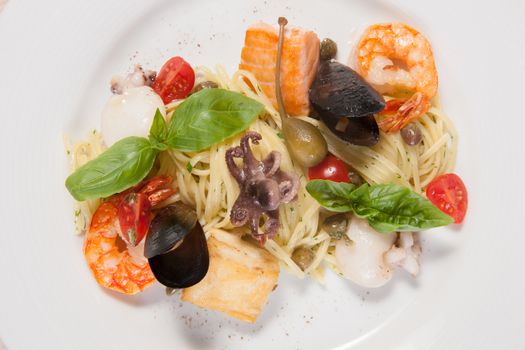 White dish with pasta and sea food