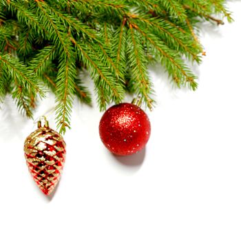 Baubles on fir branch isolated on white background