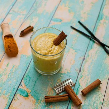 healthy smoothie with turmeric, vanilla, cinnamon and coconut milk