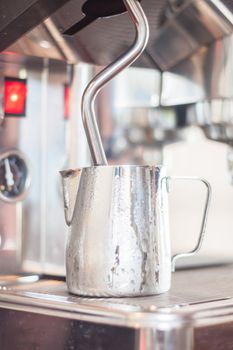 Pitcher for steaming milk, stock photo