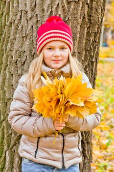 Photo of cute smiling girl in autumn