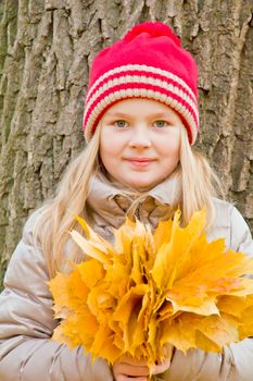 Photo of cute smiling girl in autumn
