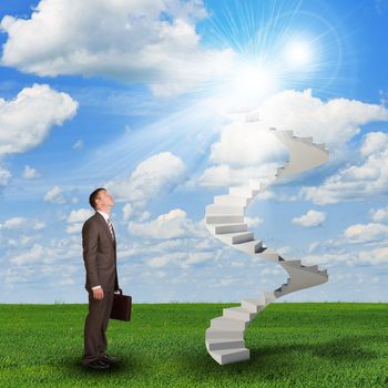 Businessman looking to stairs in sky with green grass, clouds and sun. Concept background