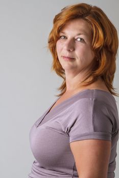 beautiful 40 year old woman with red hair and light green eyes