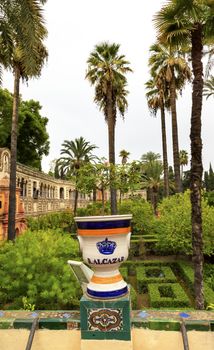 White Urn Pot Garden Alcazar Royal Palace Seville Andalusia Spain.  Originally a Moorish Fort, oldest Royal Palace still in use in Europe. Built in the 1100s and rebuilt in the 1300s. 