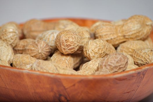 Peanuts in a brown bowl