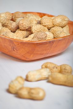 Peanuts in a brown bowl