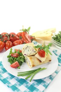 a crepe stuffed with cheese, radishes and chives