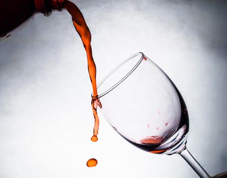 Red wine being poured into wine glass