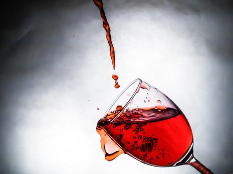 Red wine being poured into wine glass