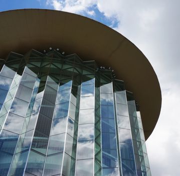 Modern skyscrapers, outer material made from glass, the roof is circular shape.                           