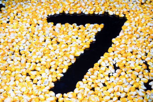 Corn made ​​the number seven on a black background.
