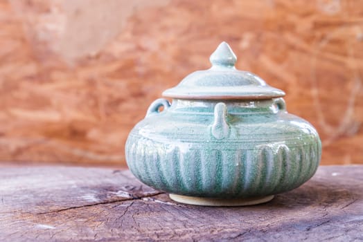 vintage ceramic pot on wood