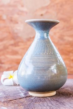 vintage ceramic vase on wood