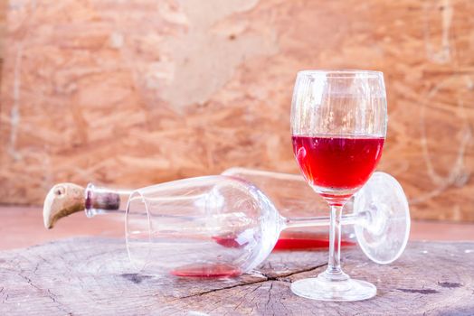 red wine on wooden background still life image