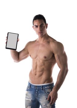 Sexy muscular shirtless young man holding a blank tablet PC while looking at camera, portrait on white