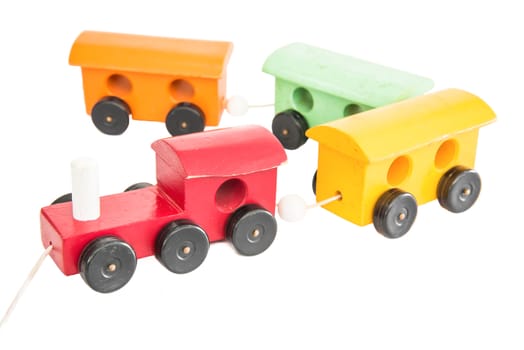 Colorful wooden toy train isolated over white