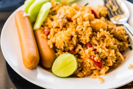 A popular meal "Fried Rice" served with  a piece of lemon.