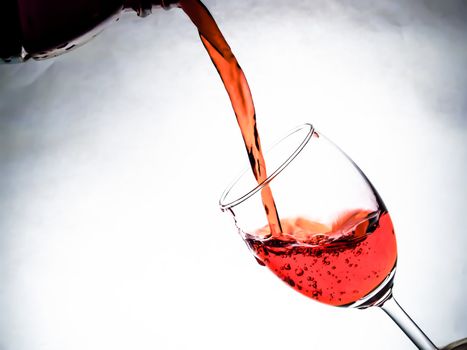 Red wine being poured into wine glass