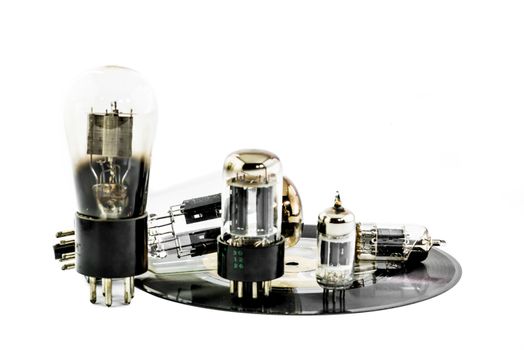 Vacuum electronic preamplifier tubes on platter
. Isolated image on white background