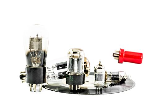 Vacuum electronic preamplifier tubes on platter
. Isolated image on white background