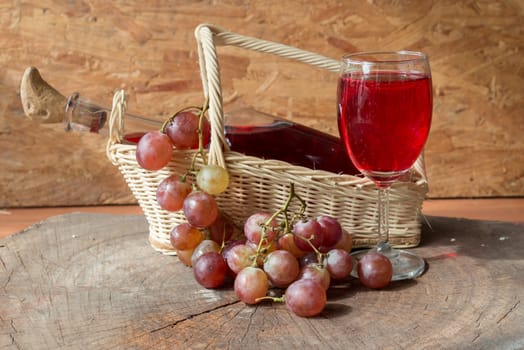 Wine and grapes on old wood.