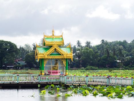 Buddhist shrine at a lotus pond in Myeik, southern Myanmar.
