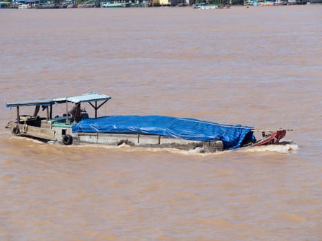Traditional Vietnamese cargo vessel on the Mekong River in Vietnam
