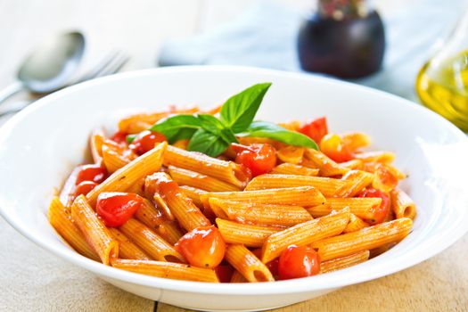 Penne in tomto sauce with basil on top