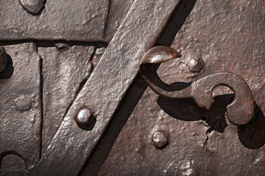 Close up of ancient door in wrought iron - Monte Lussari, Italy 