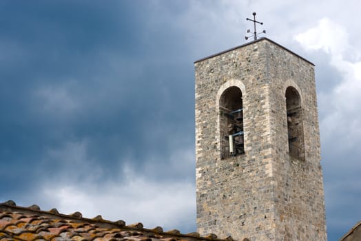 Bell tower of the Cathedral of San Gimignano (santa maria assunta) medieval town (UNESCO heritage), Siena, Tuscany, Italy