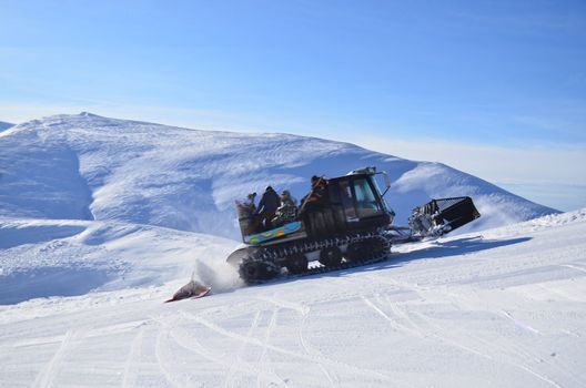 Snowcat. Pistenbully for ski slope preparation in a Ukraine ski resort.