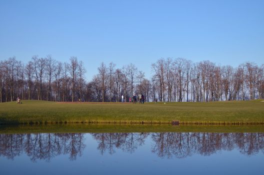 lake with reflections on a golf course in Yanukovych Mezhigorie