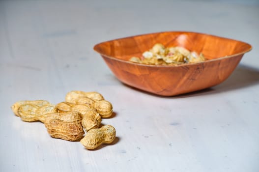 Peanuts in a brown bowl