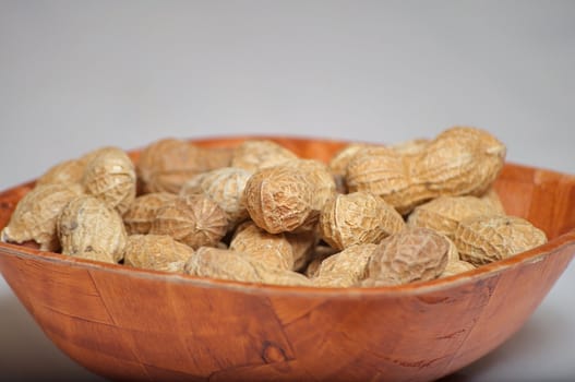 Peanuts in a brown bowl