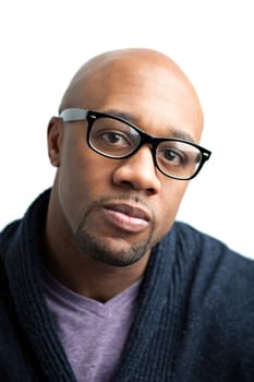 Stylish African American man wearing black framed glasses. Shallow depth of field.