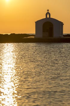 Catholic Church As Silhouette Against The Sunrise In Georgioupolis, Crete, Greece