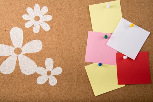 Color sticky memo note cards on cork board