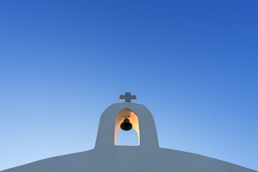 White Cross On An Othodox Church Against Blue Sky In Crete, Greece