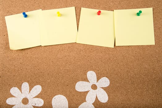 Color sticky memo note cards on cork board