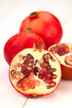 Pomegranate fruits (lat. Punica granatum) (Selective Focus, Focus on the seeds in the front)