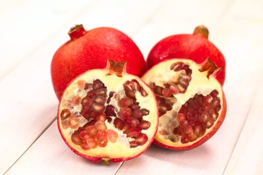 Pomegranate fruits (lat. Punica granatum) (Selective Focus, Focus on the seeds in the front)