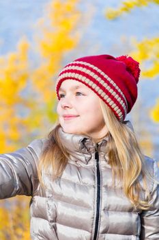 Autumn photo of beautiful girl in red hat